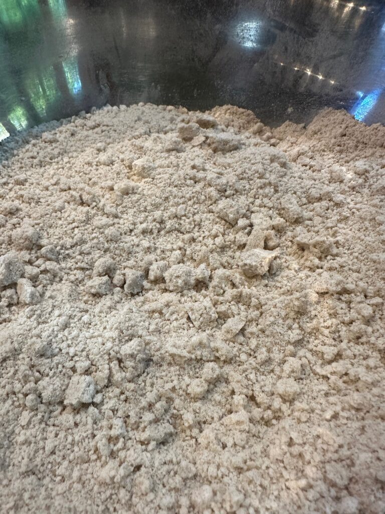 mixing flour for an apple crisp recipe