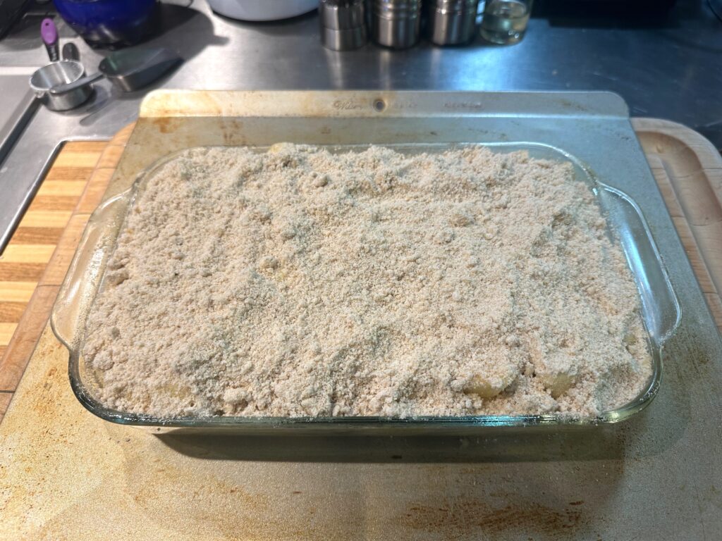 crumbling streusel mixture over apple crisp pie recipe